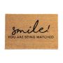 Doormat "Smile! You are being watched" 60x40 cm., light brown/black